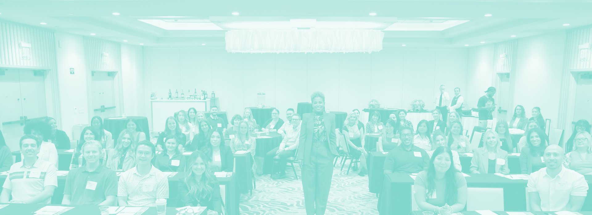 A full room of attendees at a Tiana Sanchez session