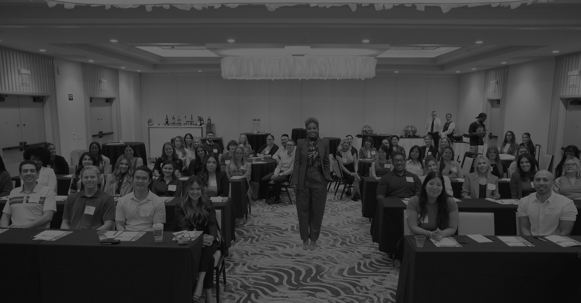 Tiana Sanchez addressing a full room