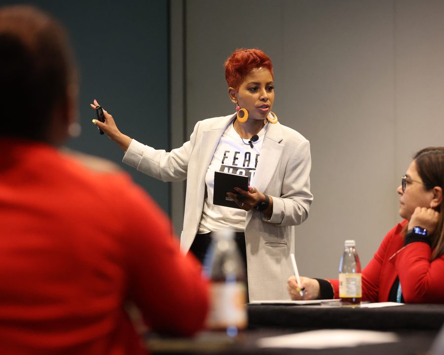Tiana Sanchez presenting to a seated room
