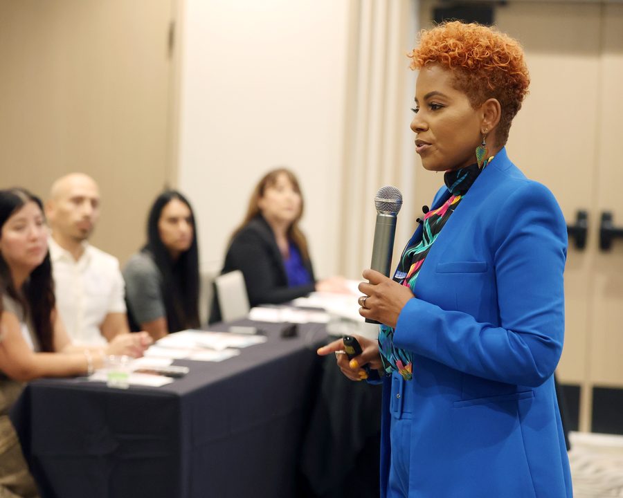 Tiana Sanchez presenting to a seated team