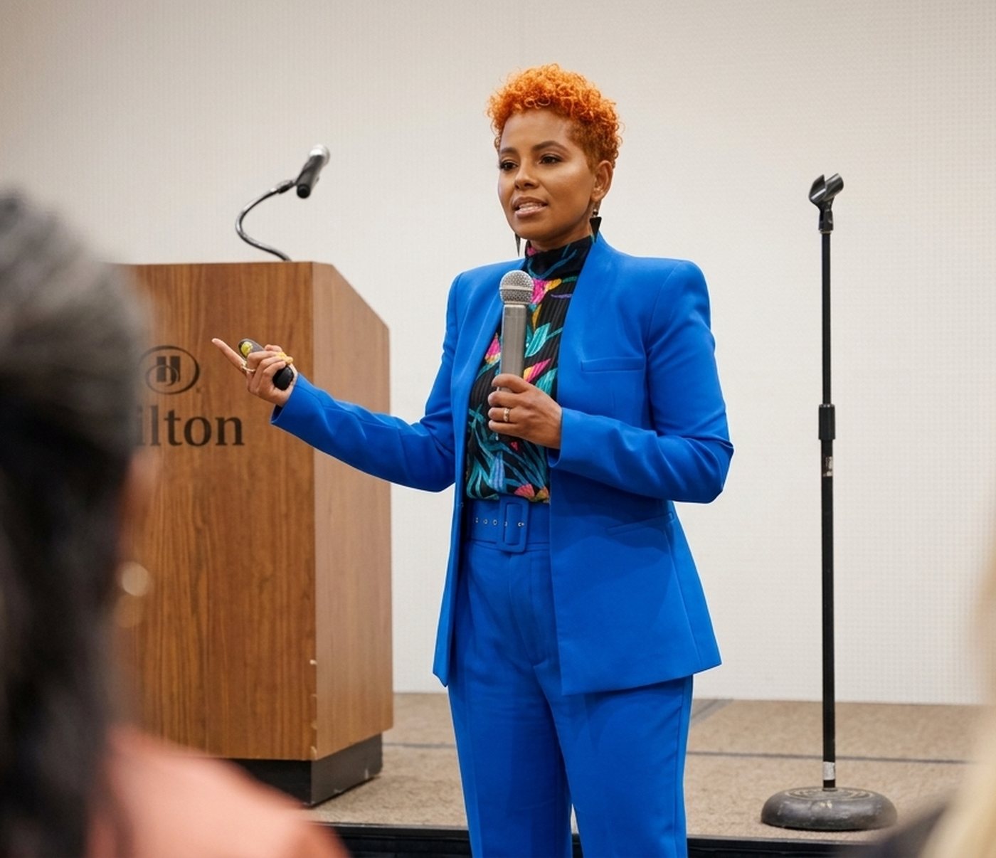 Tiana Sanchez speaking at a podium