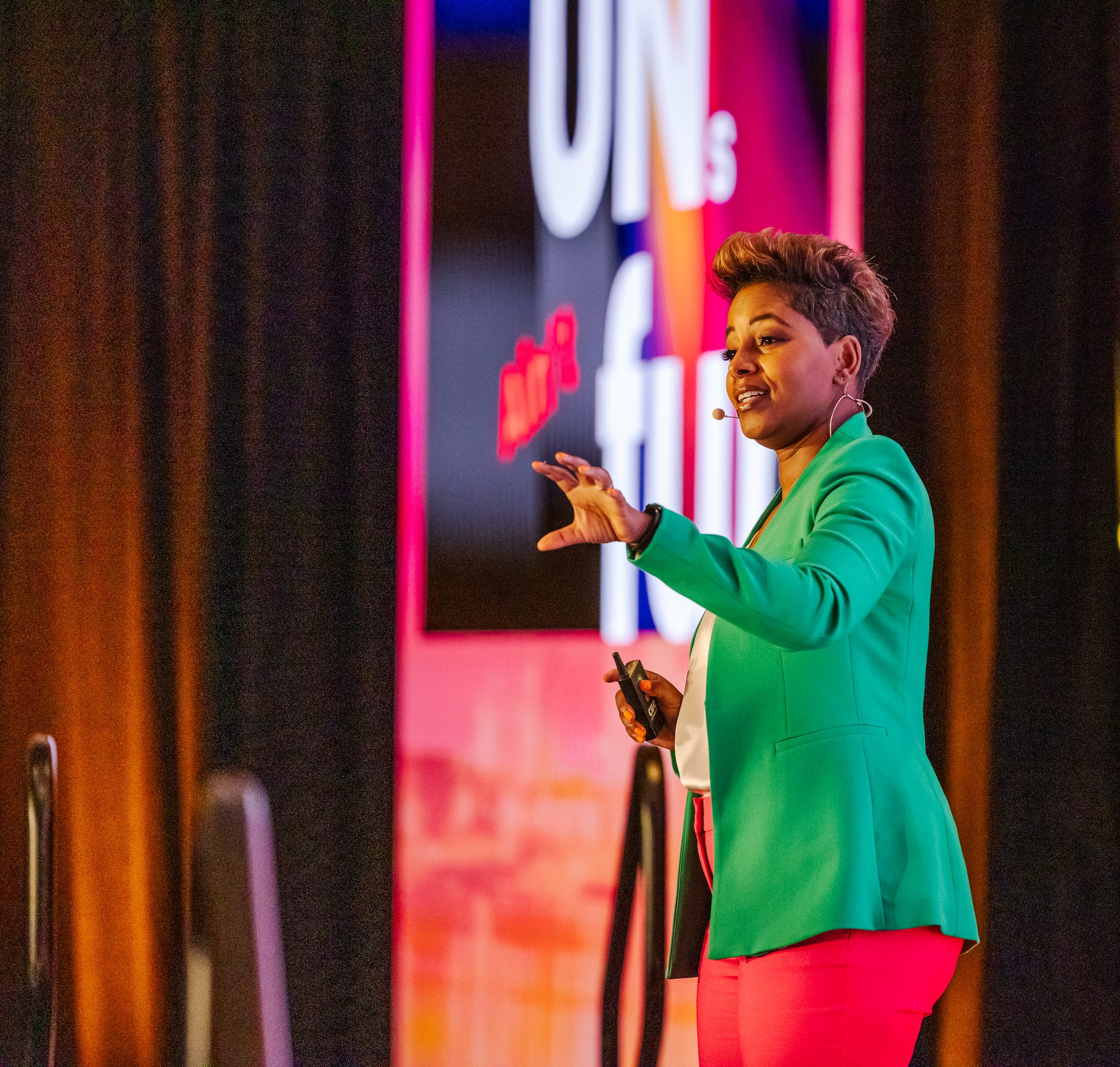 Tiana Sanchez delivering a keynote on a main stage