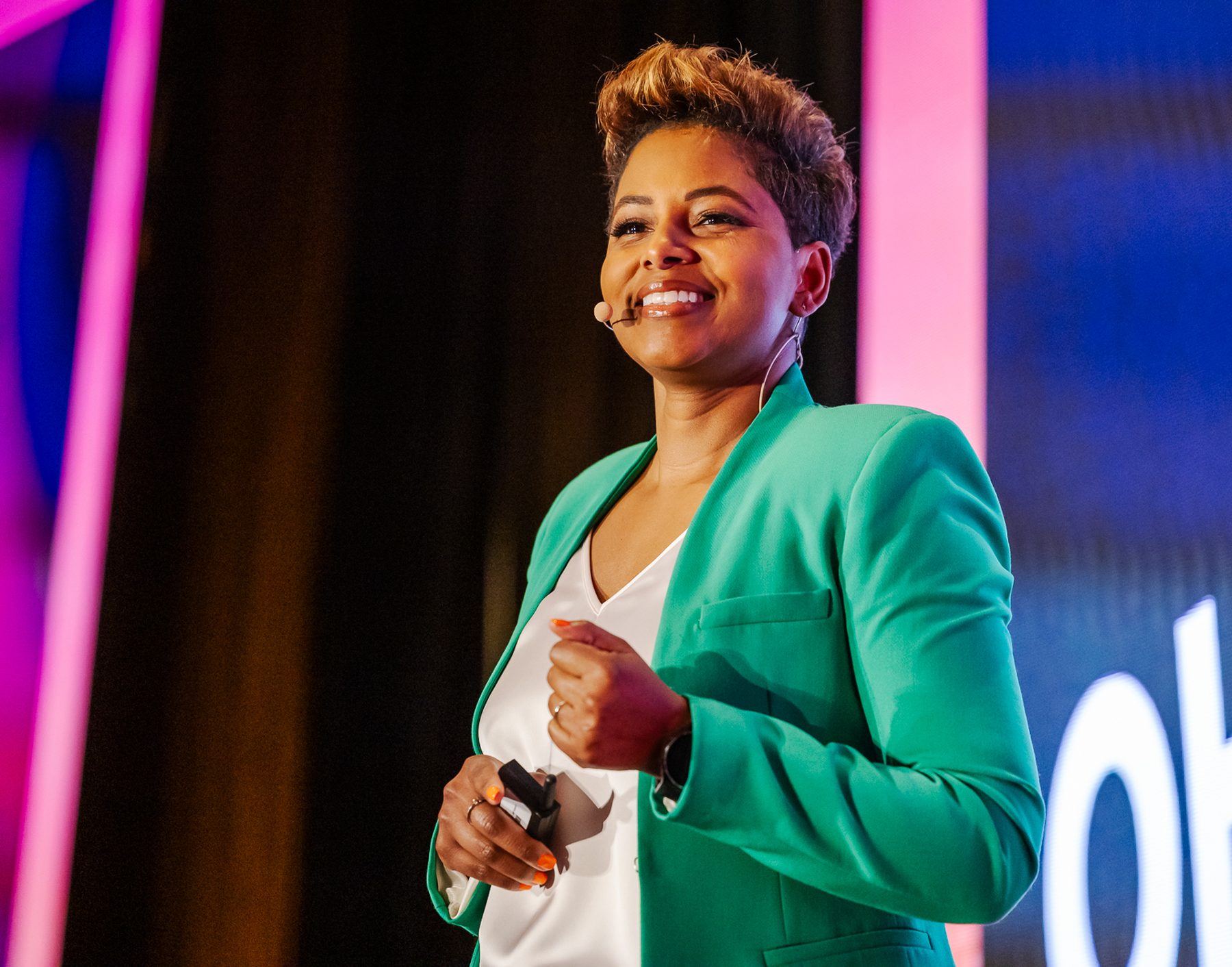 Tiana Sanchez delivering a keynote on a main stage